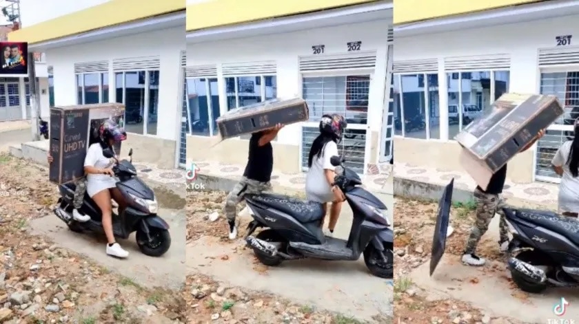 Viral: pareja intenta transportar tele de 55 pulgadas en una moto y termina mal